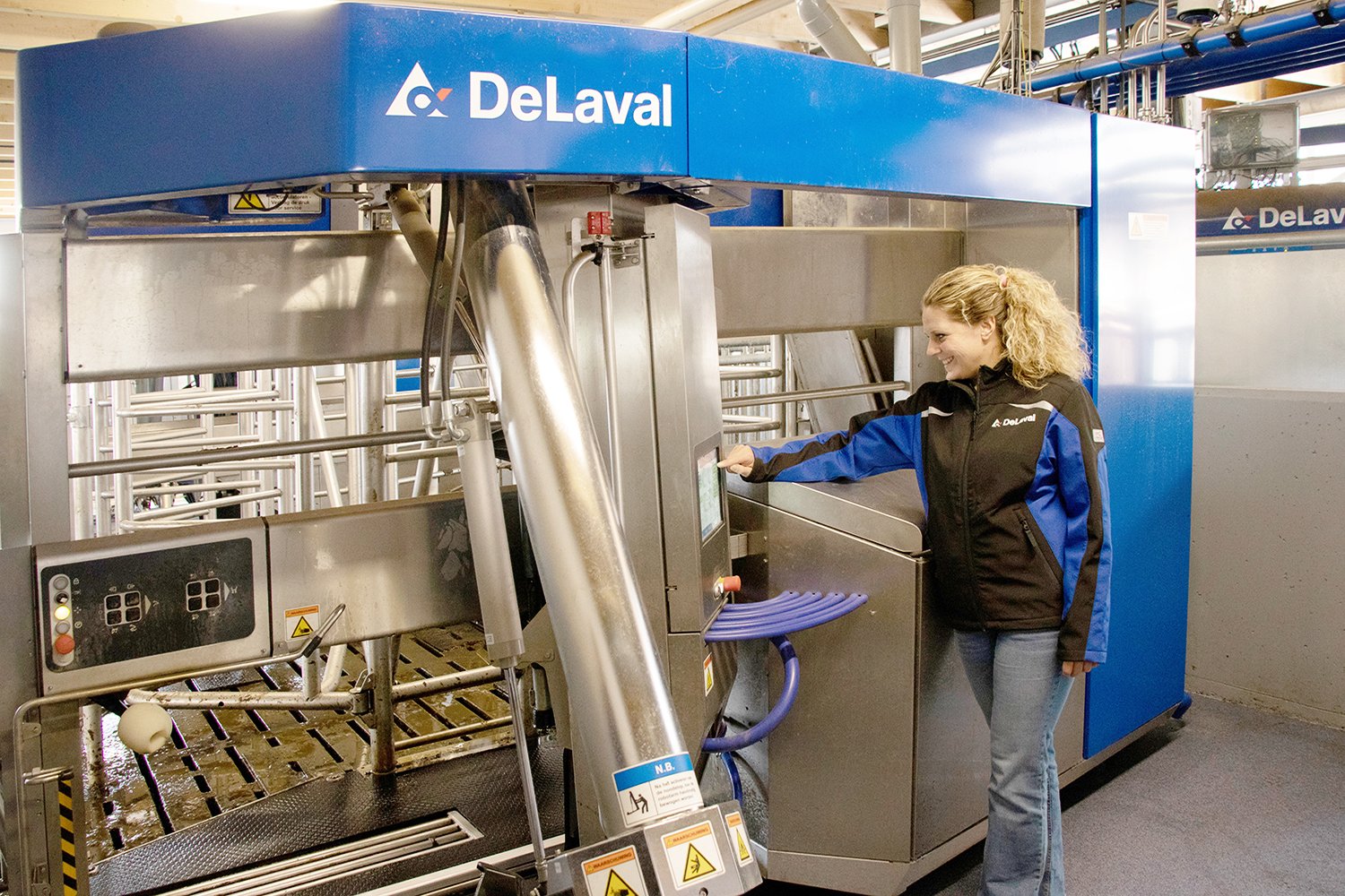 Woman operating DeLaval VMS